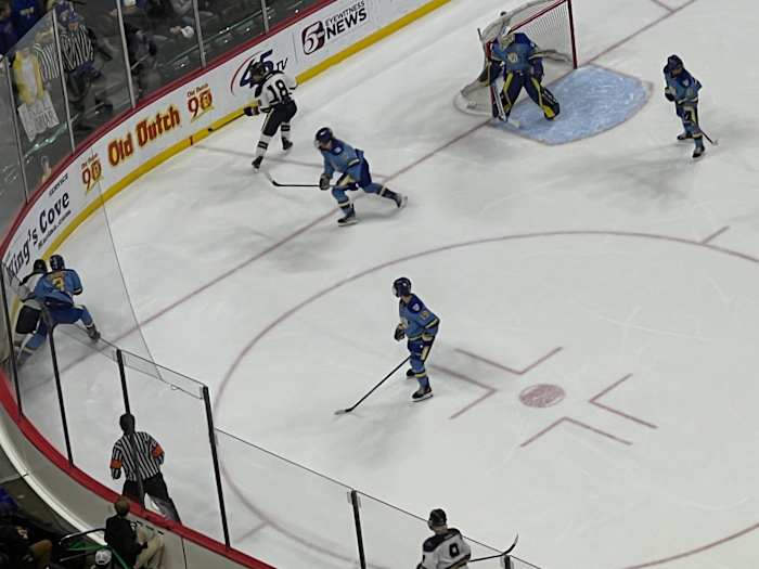 Hermantown and St. Cloud Cathedral players battle for the puck along the end boards during the first period of the Class A state boys hockey championship on Saturday, March 9, 2024, at Xcel Energy Center in St. Paul, Minn. 